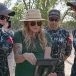 Force Blue team members reviewing tablet outdoors during field operation
